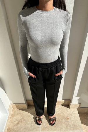 Brooklyn Top by Mossman – a fitted knit top with high neckline and thumb sleeves. Perfect for layering or everyday wear.