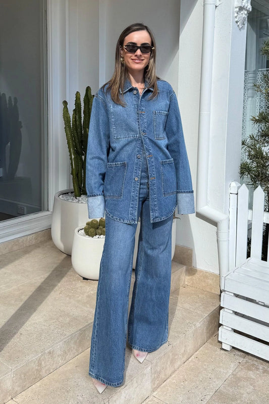 Brynn Denim Jean in Classic Blue by Camilla and Marc, high-waisted, flared-leg silhouette with a super high-rise fit, five-pocket design, and logo shank button.