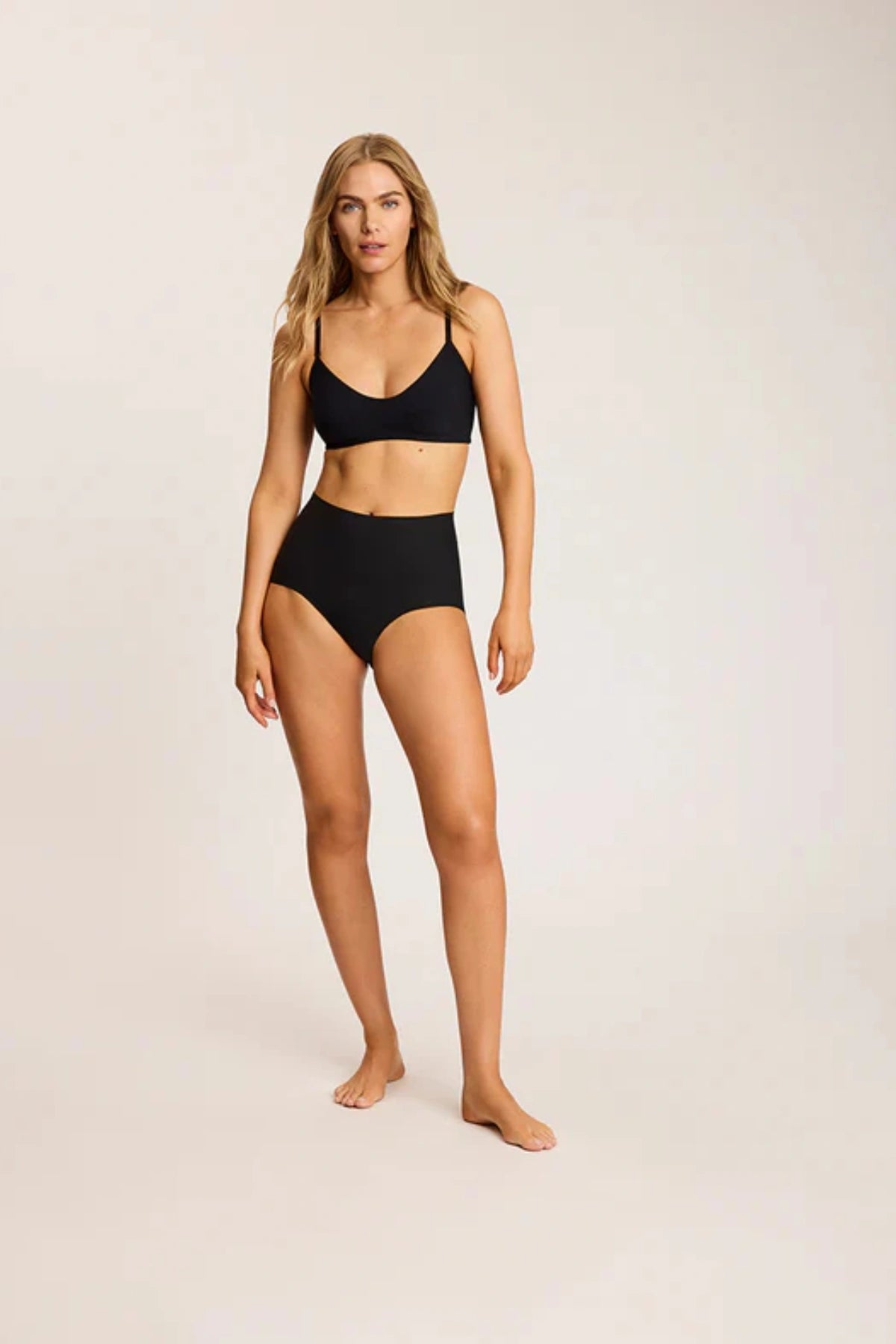 Butter Bralette in Black by Commando, ultra-soft Austrian modal blend with adjustable straps, bust shirring, and lined front for all-day wireless comfort.