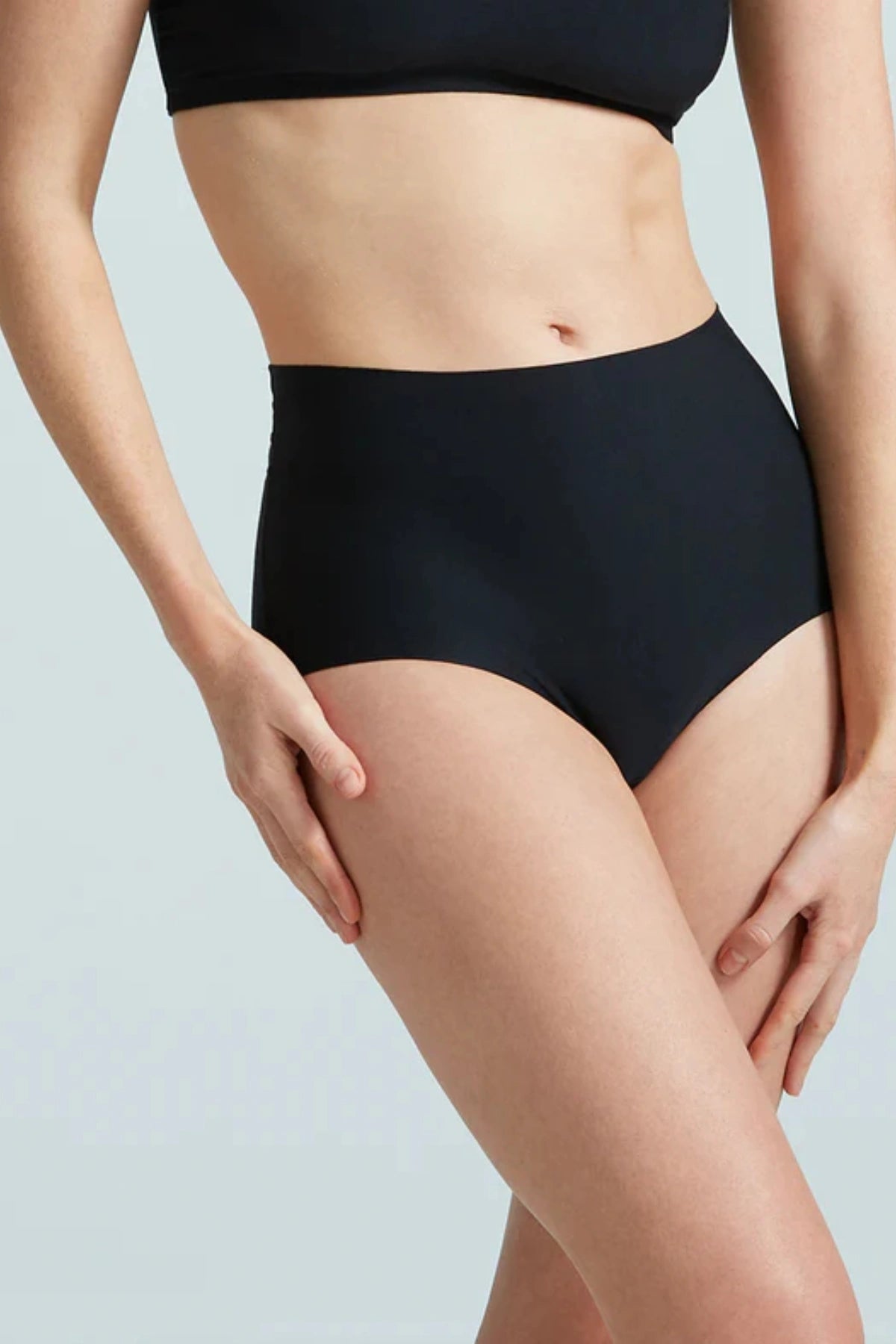 Butter High-Rise Bikini in Black by Commando, ultra-soft Austrian modal blend with high-rise fit and raw-cut edges for seamless, all-day comfort.