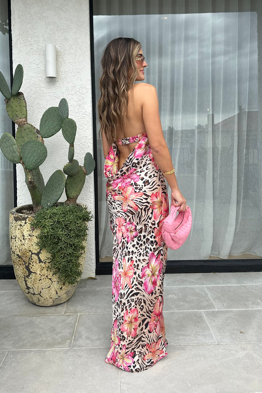 Hera Maxi Dress Safaria by Cin Cin – A trendy maxi blending vibrant floral and animal prints with a halter neckline and flowing silhouette. Perfect for resort wear and tropical events.