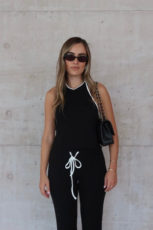 Charlie Halter Top Black/White by Sneaky Link - Trendy summer staple with chic halter neckline and open back. Perfect for beach days or viral nightlife vibes.