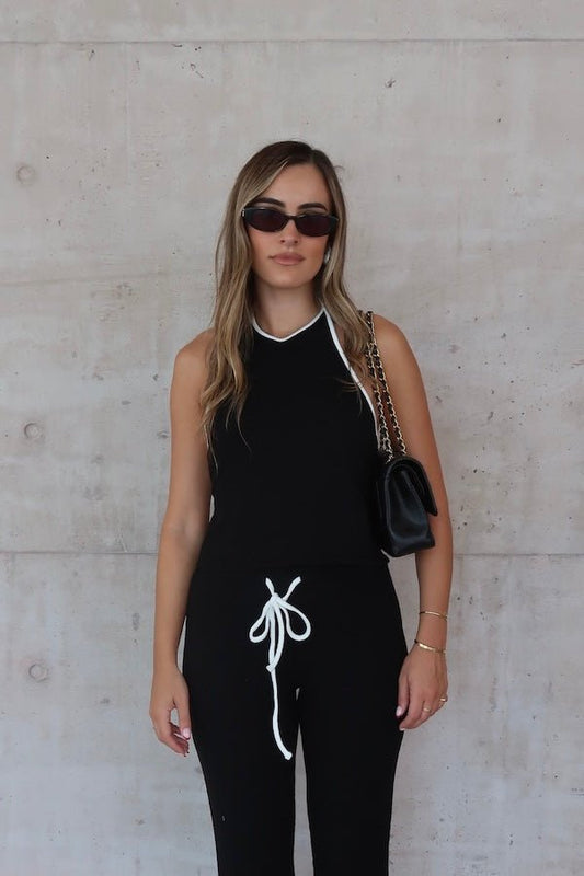 Charlie Halter Top Black/White by Sneaky Link - Trendy summer staple with chic halter neckline and open back. Perfect for beach days or viral nightlife vibes.