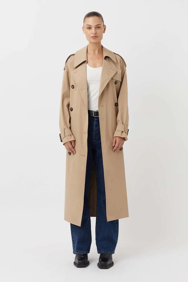 Evans Trench Coat Sand by Camilla and Marc — Oversized twill trench with double-breasted front, epaulettes, belt, and recycled polyester lining. Dry clean only.