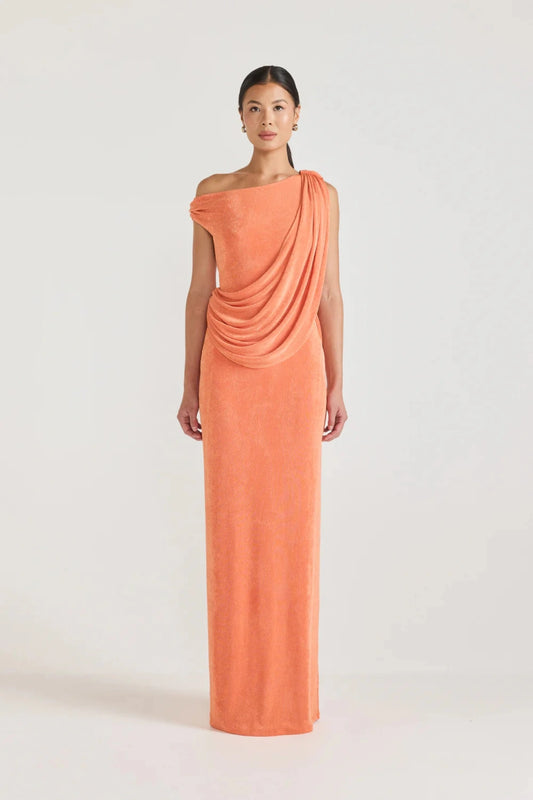 Caliste Dress Apricot by Tojhà, off-shoulder jersey maxi with draped detail and back split, a trendy piece perfect for weddings, events or chic evenings.