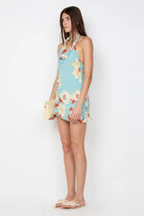 Calliope Mini Dress by Bec and Bridge — a floral cowl-neck mini with a beaded strap and asymmetric hem, perfect for elegant resort evenings.