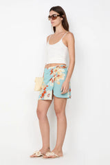 Calliope Mini Skirt by Bec and Bridge — a floral wrap mini with a beaded waist and hip cutout, perfect for polished day-to-night styling.
