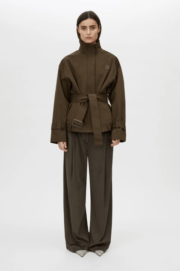 Aileron Bomber Trench in Cypress by Camilla and Marc, zip-through bomber-style trench, branded leather patch, pleated front and back, topstitched belt with pewter buckle, made from 100% cotton and 100% recycled polyester lining.