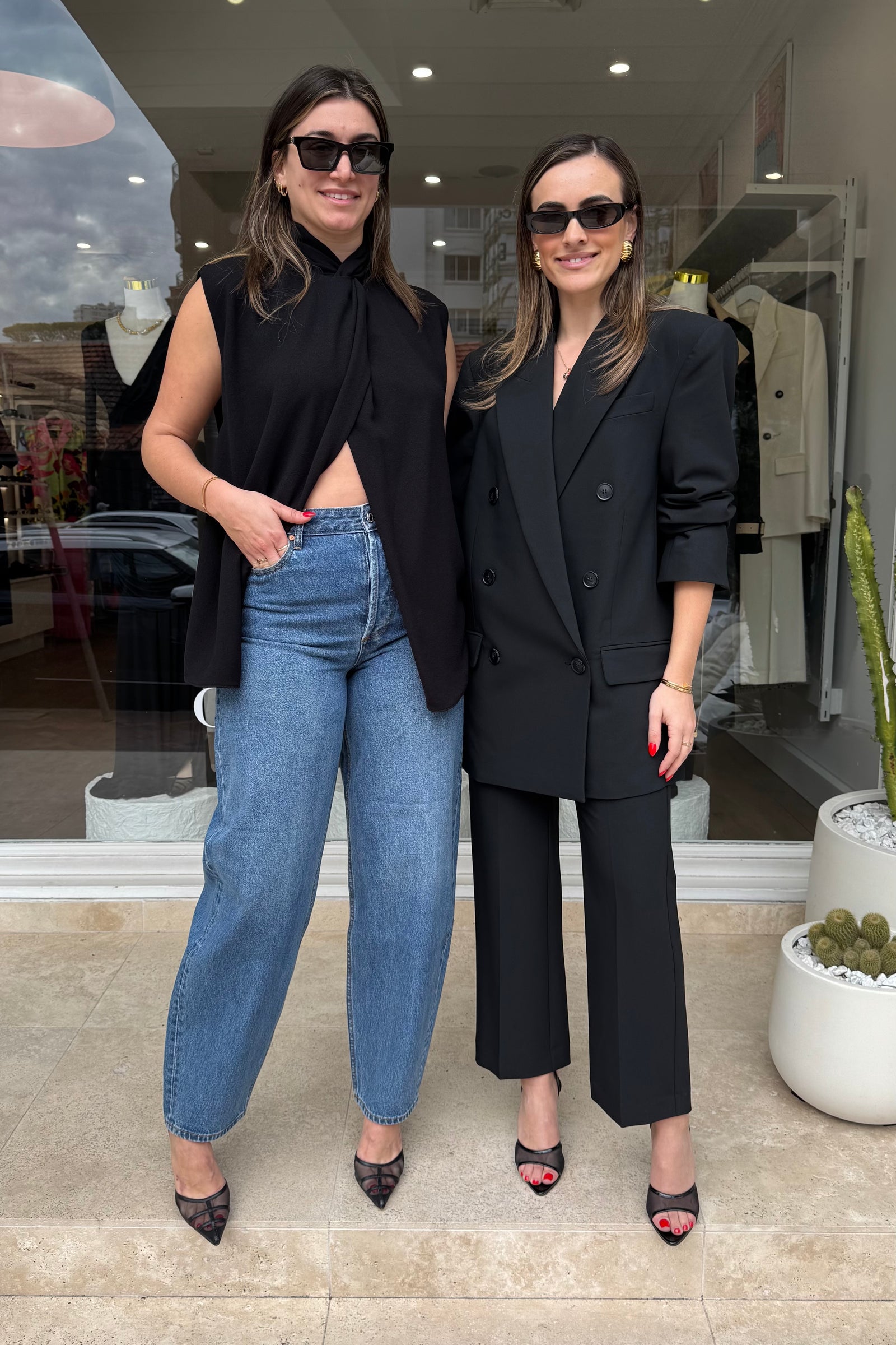 Oriole Twist Neck Top in Black by Camilla and Marc, twist neck design with button-loop closure, invisible zip at the back, fully lined for structure, crafted from 100% recycled polyester.