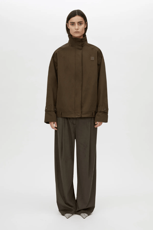 Tait Lounge Pant in Elm by Camilla and Marc, relaxed pant with deep pleats, slanted front pockets, back welt pockets, jigger button and hook-and-bar closure, crafted from 94% polyester and 6% elastane.