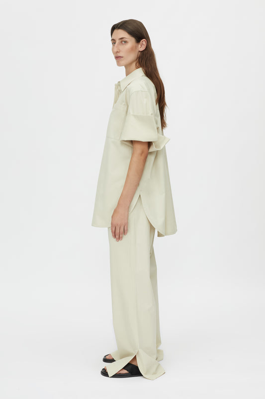 Camilla and Marc Winslow Pant Stone, a relaxed cotton-tencel pant with drawcord waist and side splits, perfect for effortless everyday sophistication.