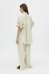 Camilla and Marc Winslow Pant Stone, a relaxed cotton-tencel pant with drawcord waist and side splits, perfect for effortless everyday sophistication.