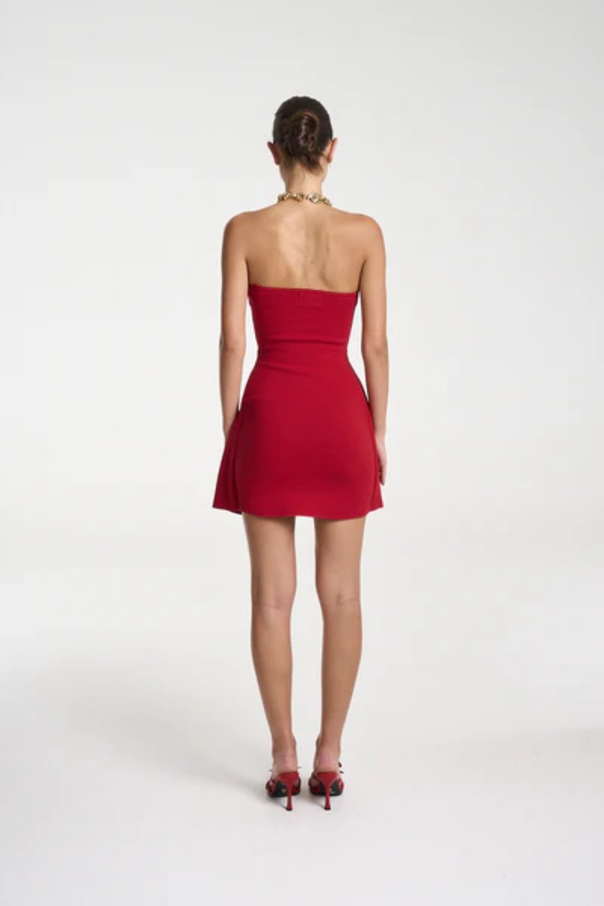 Candy Mini Dress by Summi Summi — a cardinal red strapless knit mini with tie-front detail and flared silhouette, perfect for confident styling.