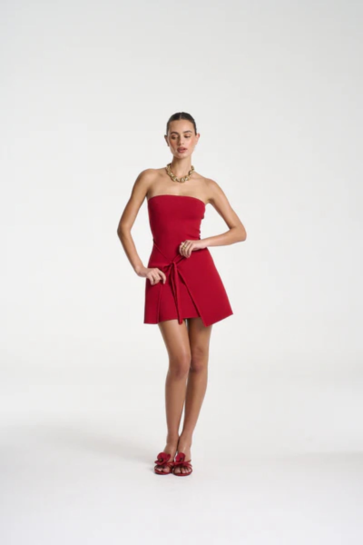 Candy Mini Dress by Summi Summi — a cardinal red strapless knit mini with tie-front detail and flared silhouette, perfect for confident styling.