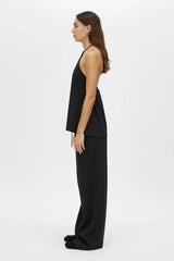 Canova Apron Top by Camilla and Marc, a black jersey apron-style tank with tie-back straps, side splits and embroidered hem.