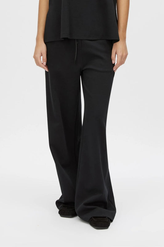 Canova Pant by Camilla and Marc, a relaxed black jersey pant with drawcord waist, faux fly detail and mid-rise fit.