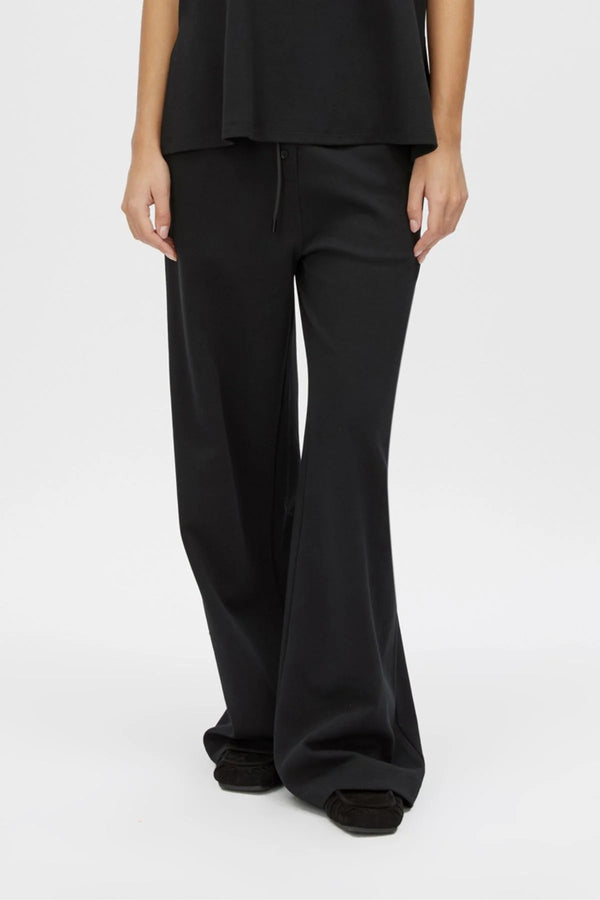 Canova Pant by Camilla and Marc, a relaxed black jersey pant with drawcord waist, faux fly detail and mid-rise fit.
