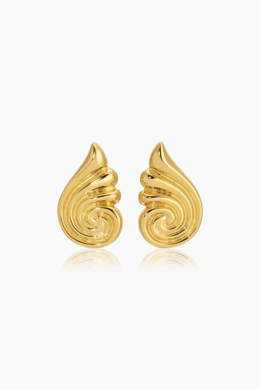 Capri Earrings Gold by Heaven Mayhem – sculptural gold swirl earrings in polished stainless steel.