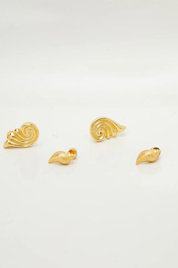 Capri Earrings Gold by Heaven Mayhem – sculptural gold swirl earrings in polished stainless steel.
