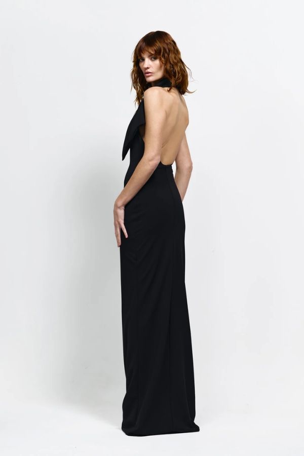 Carlson Gown in Black by Effie Kats, asymmetrical neckline with draped bodice and dramatic open back, perfect for making a refined and elegant statement at evening events or formal occasions.