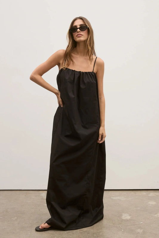 Carrie Maxi Dress in Black by Bayse, voluminous cotton maxi with gathered neckline and adjustable straps for effortless modern elegance.