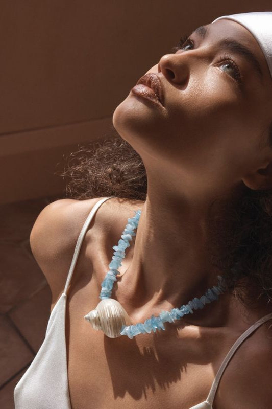 Cassis Necklace by Amber Sceats, handcrafted in Italy with aquamarine stones and seashells plated in 24K gold for coastal luxury.
