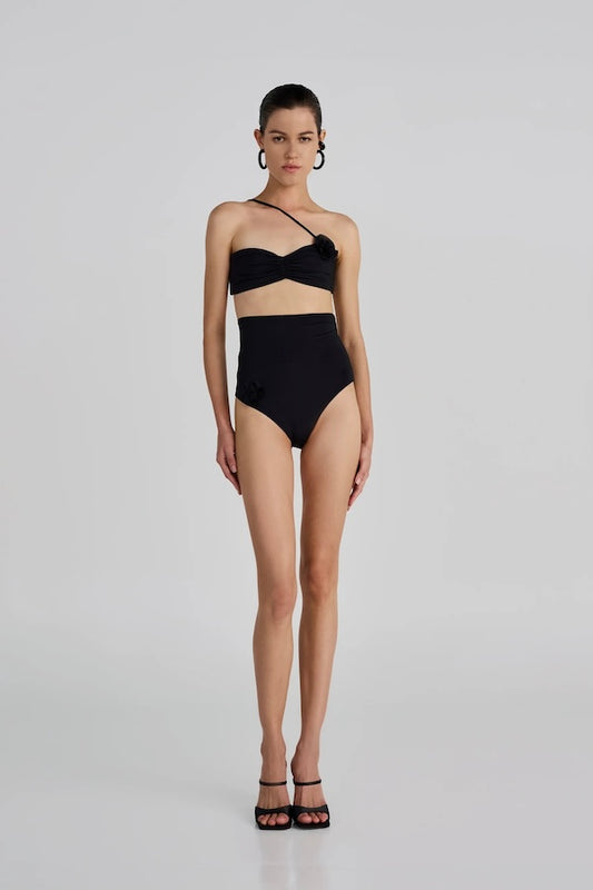 Castano Two Piece Black by Maygel Coronel, ruched bikini with floral detail and high rise bottoms. Perfect for beach days or bold swim looks.