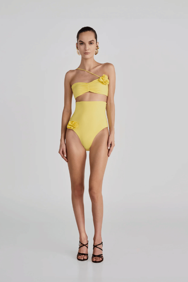 Arrebol One Piece Off White by Maygel Coronel, ruched swimsuit with floral detail and neck strap. Perfect for beach days or elegant swim looks.