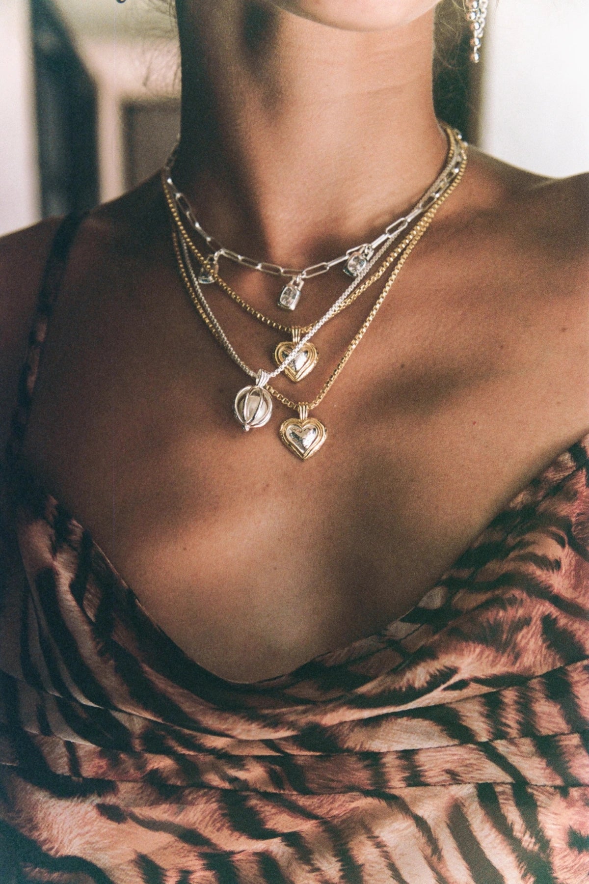 Celine Necklace by Mountain and Moon — a two-tone heart pendant on a gold chain, perfect for everyday layering and modern feminine styling.