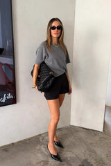 Charli Knit Tee in grey, featuring a soft knit fabric and a relaxed, short-sleeve fit.