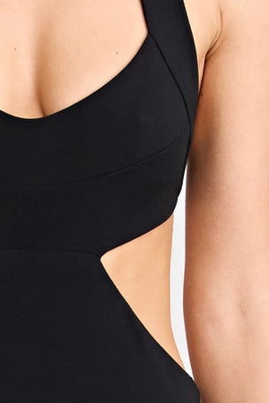 Charlie Dress Black by Pfeiffer, featuring a halter neckline, waist cut-outs and a tulip hem for an effortlessly flattering evening look.
