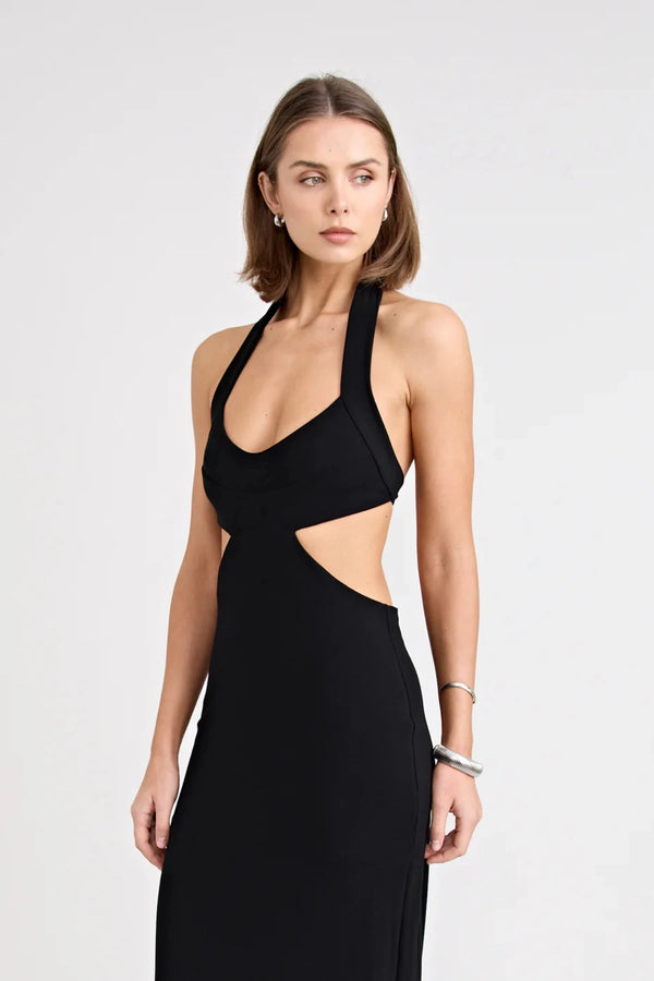 Charlie Dress Black by Pfeiffer, featuring a halter neckline, waist cut-outs and a tulip hem for an effortlessly flattering evening look.
