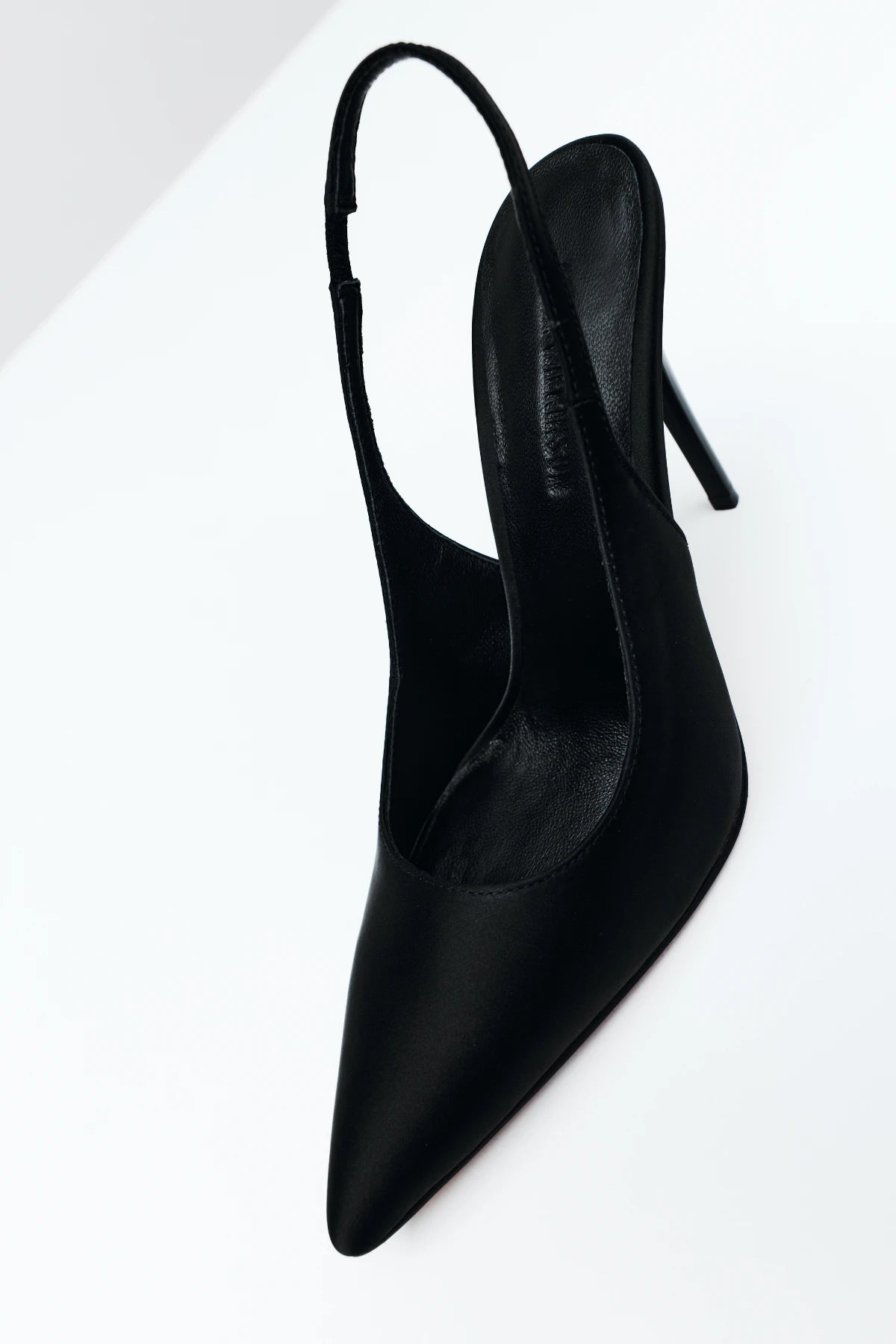 Charlize Pump in Black Satin by Lana Wilkinson, a pointed-toe slingback with elastic strap, 10cm heel, and sleek satin finish.