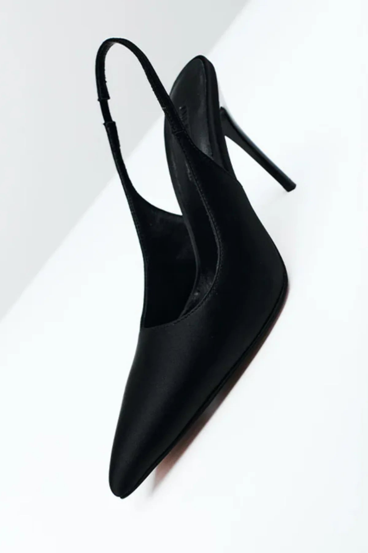 Charlize Pump in Black Satin by Lana Wilkinson, a pointed-toe slingback with elastic strap, 10cm heel, and sleek satin finish.