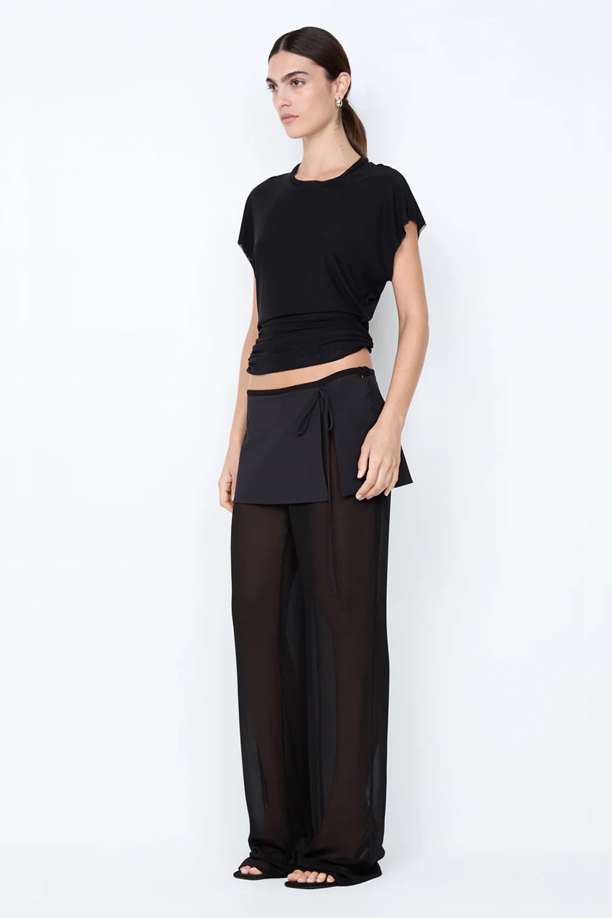 ChatGPT said:

Winnie Cut Out Tee by Bec + Bridge, a sleek mesh top with gathered neckline, circular back cutout, and draped cowl for modern feminine flair.