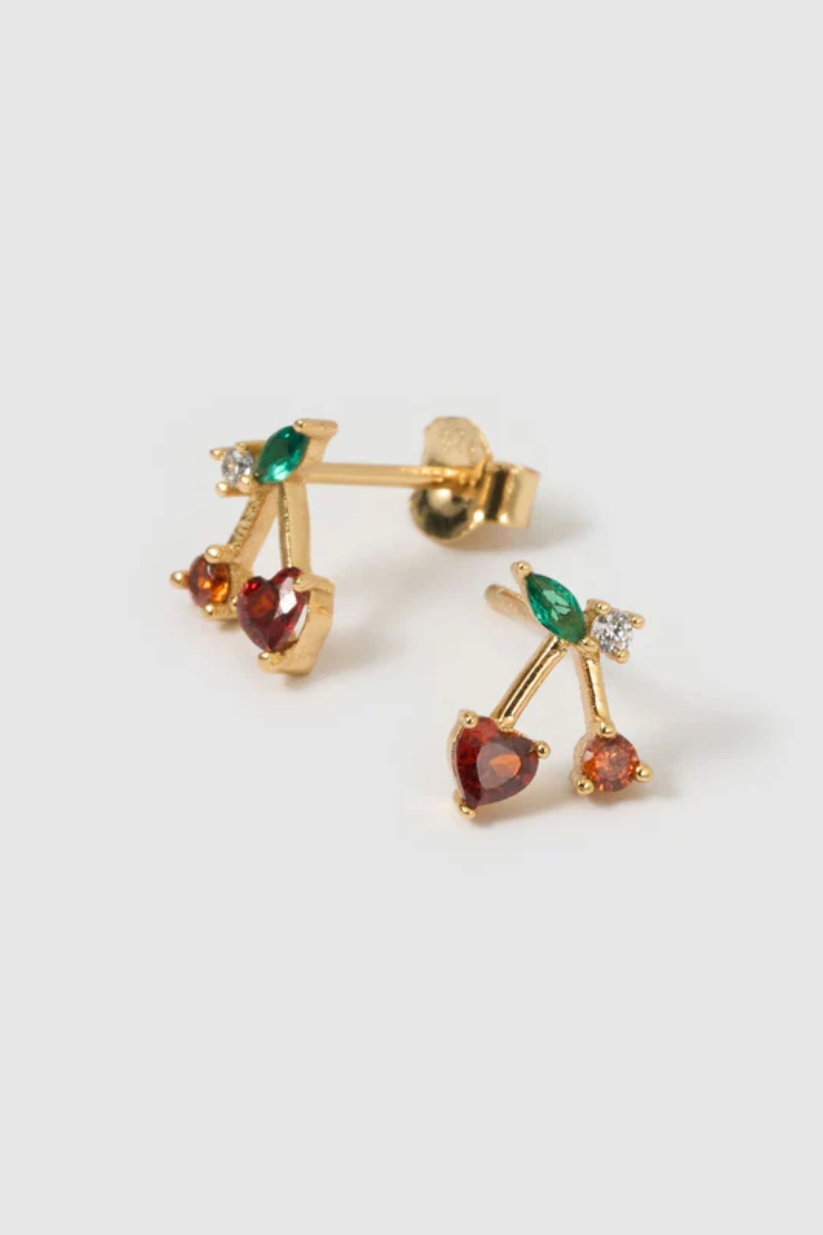 Cherry Bomb Stud Earrings by Arms of Eve, playful cherry-inspired studs with vibrant zircon stones for a fun, colourful pop to any ear stack.