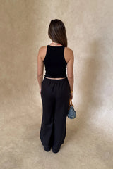 Luna Linen Pant in Black by Sneaky Link – a breathable linen pant with elastic waist and relaxed fit. Perfect for effortless summer styling.