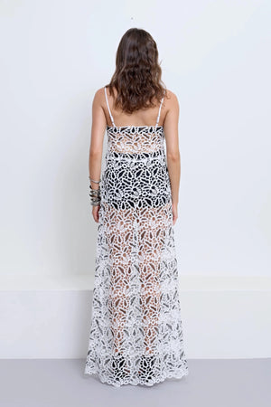 Chloe Dress With Underlayer Powder by Pfeiffer – monochrome crochet dress with scalloped edging, adjustable straps and matching underlayer shorts.