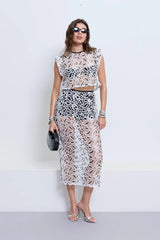 Chloe Top Powder by Pfeiffer – cropped monochrome crochet top with crew neckline and keyhole back detail.
