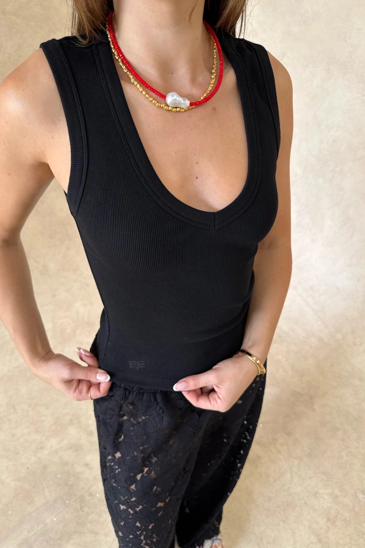 Christina Tank Black by Sneaky Link, sleek ribbed tank with scoop neckline and fitted shape. Perfect for effortless elevated basics.