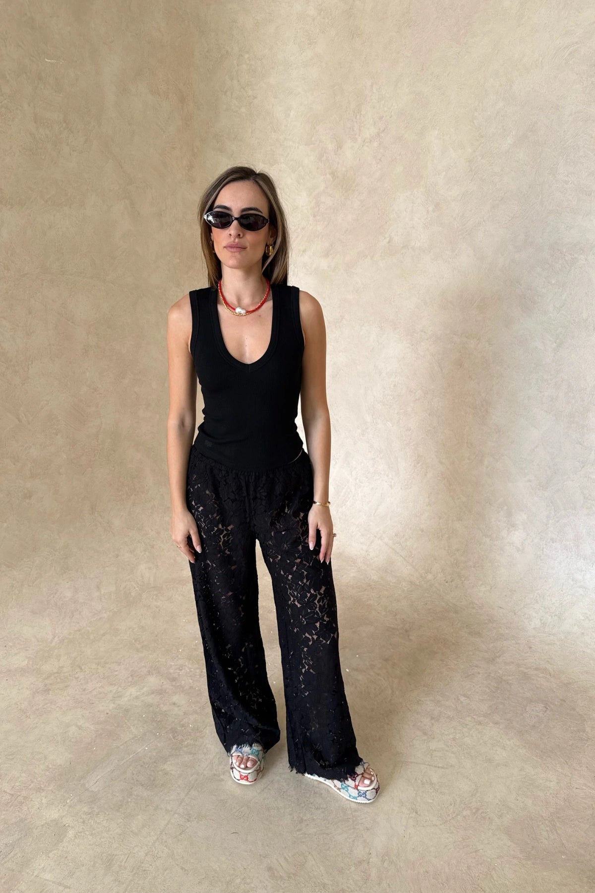 Christina Tank Black by Sneaky Link, sleek ribbed tank with scoop neckline and fitted shape. Perfect for effortless elevated basics.