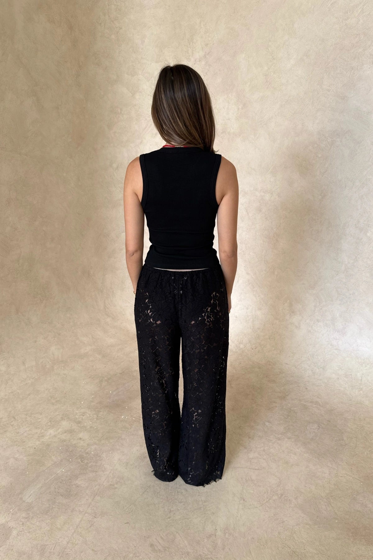 Christina Tank Black by Sneaky Link, sleek ribbed tank with scoop neckline and fitted shape. Perfect for effortless elevated basics.