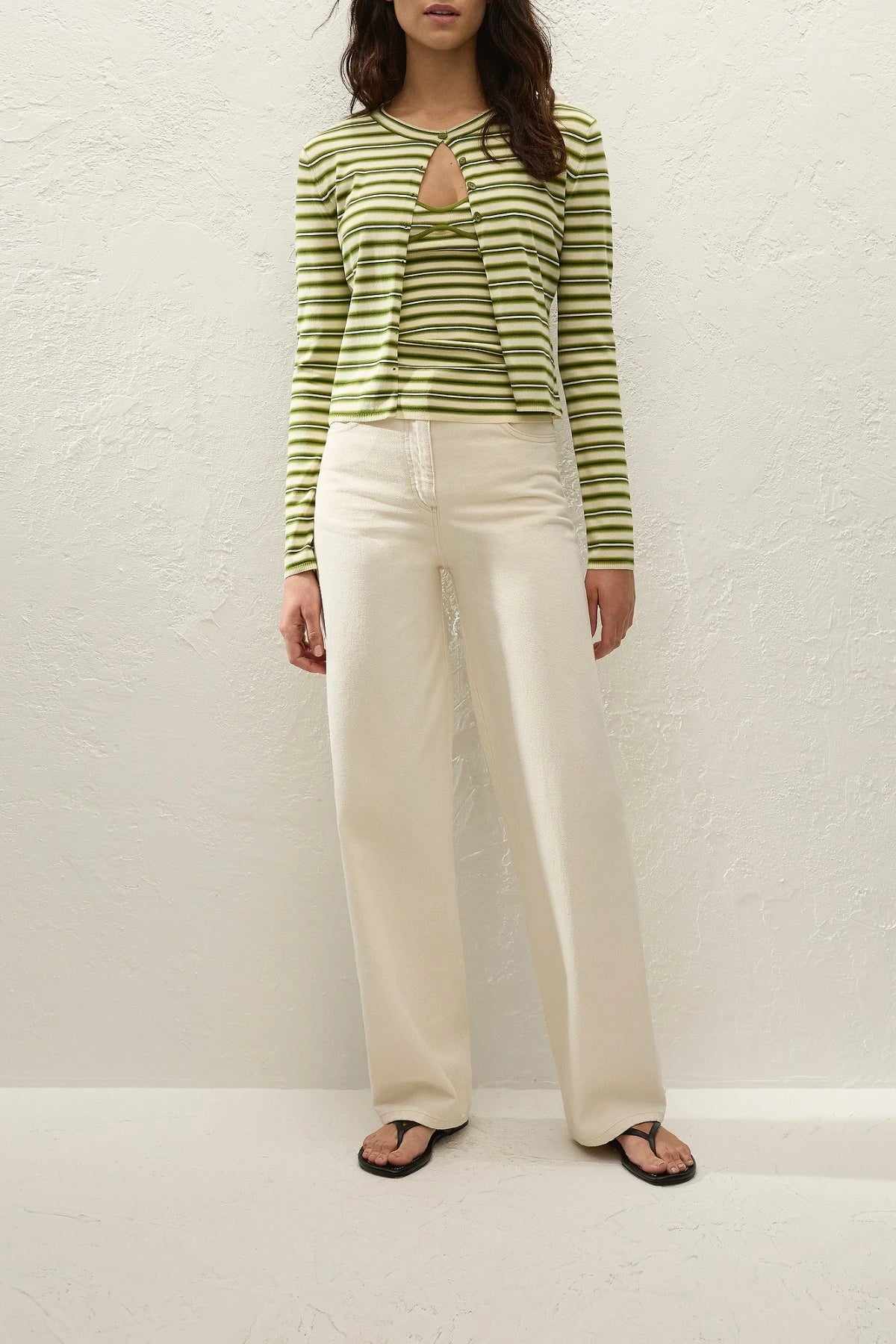 Cinta Cardigan by Faithfull the Brand — an ombré striped knit cardigan with a rounded neckline and fitted sleeves, perfect for easy layering.