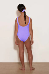 Classic Swim in Lilac by Hunza G, stretchy crinkle one-piece designed for ages 7–12. Ideal for sunny vacations and swim play.