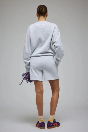 Club Med Sweatshirt in Cloud by Araminta James, relaxed cotton brushed fleece with contrast sleeves and velvet applique, perfect for chic everyday sets.