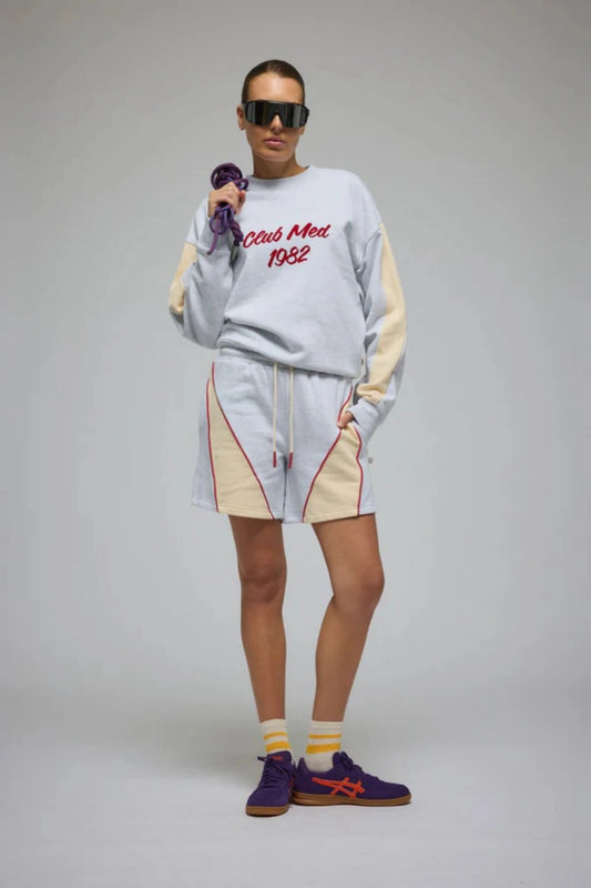 Club Med Sweatshirt in Cloud by Araminta James, relaxed cotton brushed fleece with contrast sleeves and velvet applique, perfect for chic everyday sets.