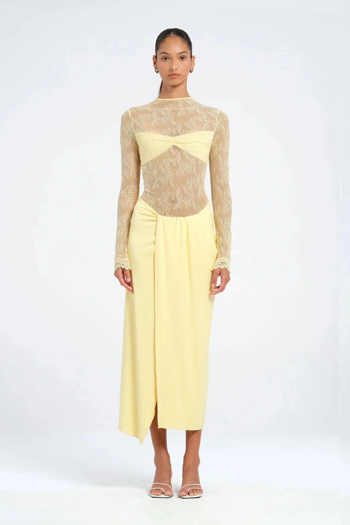 Colton Midi Dress Butter by Benni – A trendy high-neck lace dress with elegant open back, built-in bralette, and soft jersey skirt with thigh-high split, perfect for sophisticated daytime and evening events