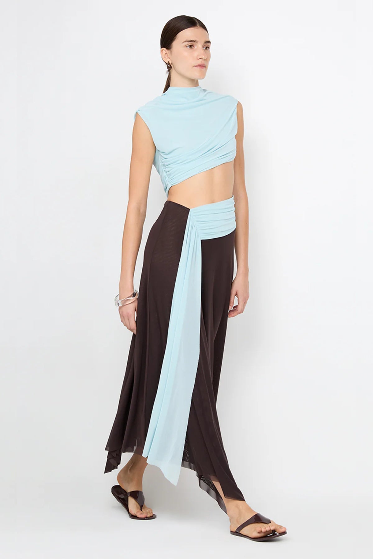 Conni Asym Midi Dress by Bec + Bridge, a two-tone mesh silhouette with cut-out waist, gathered sash, and raw hem for sculptural evening allure.