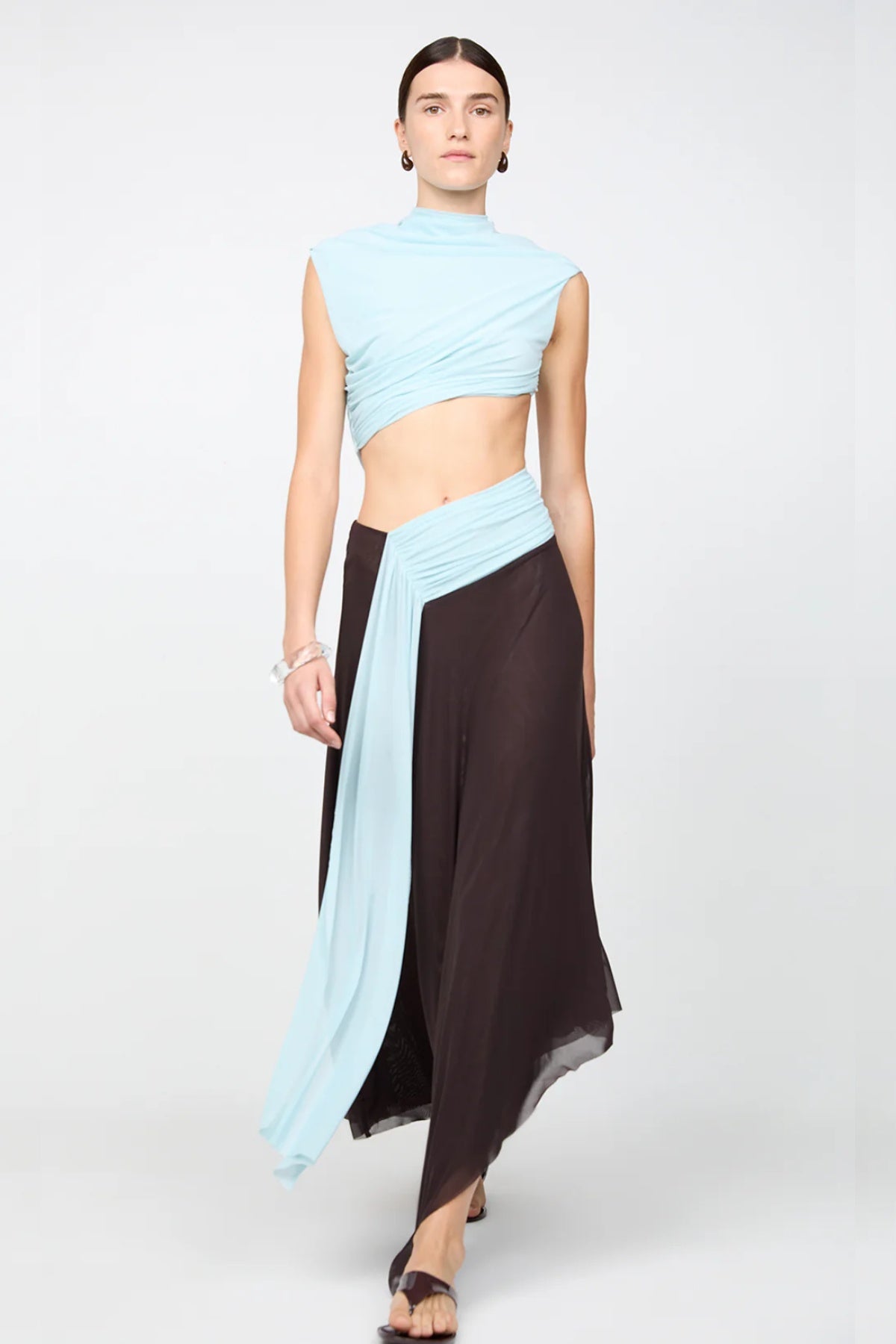 Conni Asym Midi Dress by Bec + Bridge, a two-tone mesh silhouette with cut-out waist, gathered sash, and raw hem for sculptural evening allure.