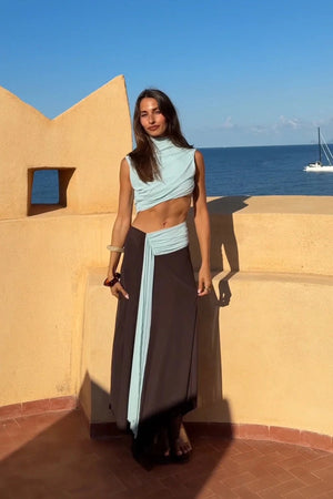 Conni Asym Midi Dress by Bec + Bridge, a two-tone mesh silhouette with cut-out waist, gathered sash, and raw hem for sculptural evening allure.